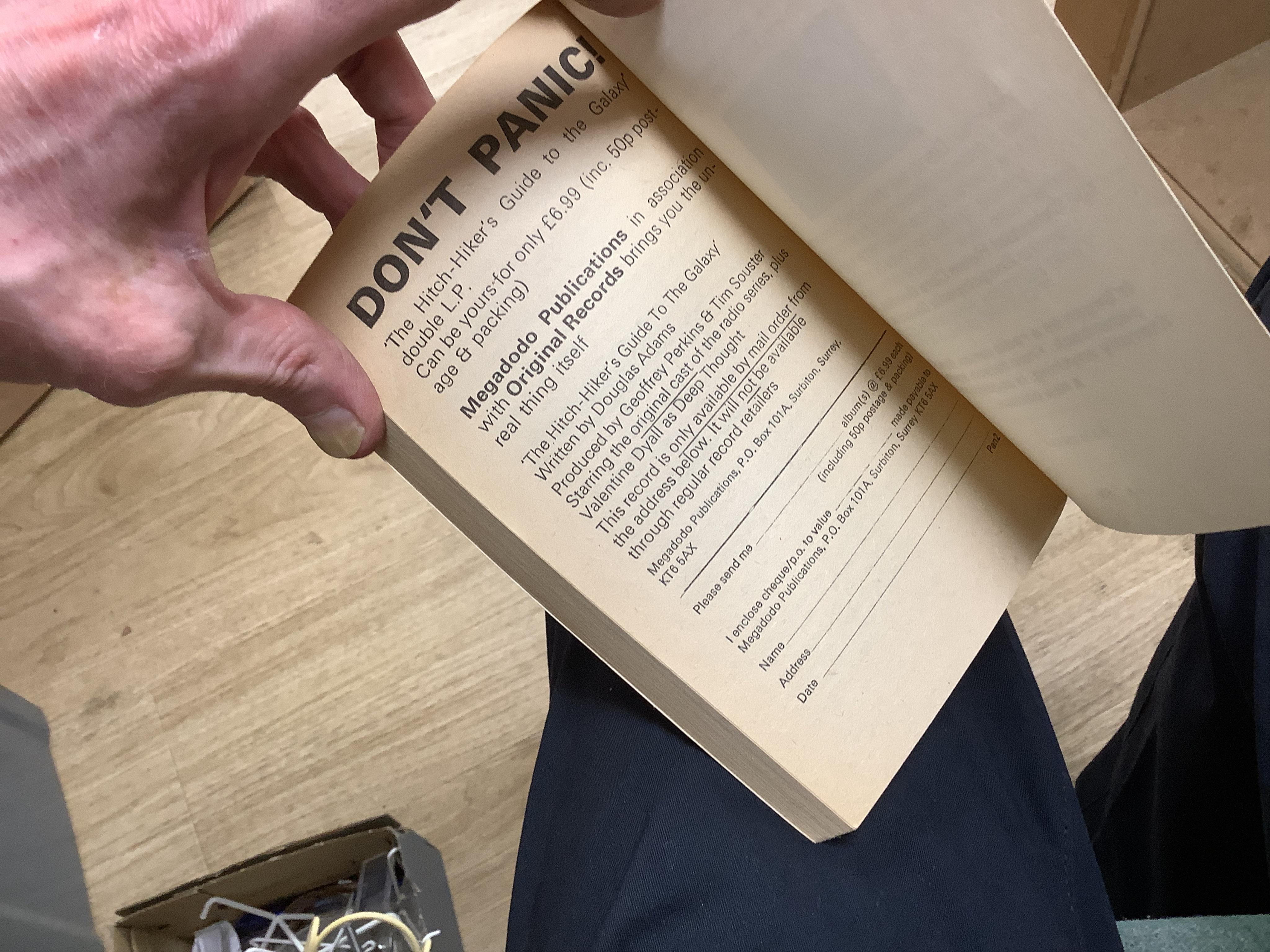 Adams, Douglas - The Hitch Hiker's Guide to the Galaxy. first edition, 2nd printing. half title/radio series leaf; paperback, sm. 8vo. Pan Books, 1979. *published same year as first and with a differently designed cover;